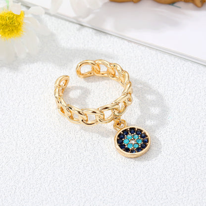 Juego de anillos con dije de mal de ojo dorado